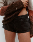Nagnata Low Rise Micro Denim Short in Washed Black