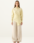 Esmaee Bayview button-down shirt in lemon yellow stripe with a wrap-front waist tie and long sleeves.