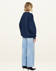 Anine Bing Miles Oversized Letterman Sweatshirt in WASHED NAVY