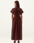 Back view of a chocolate brown Sovere Lyra midi dress in stretch cotton with a pleated bodice, magyar sleeves, and full skirt.