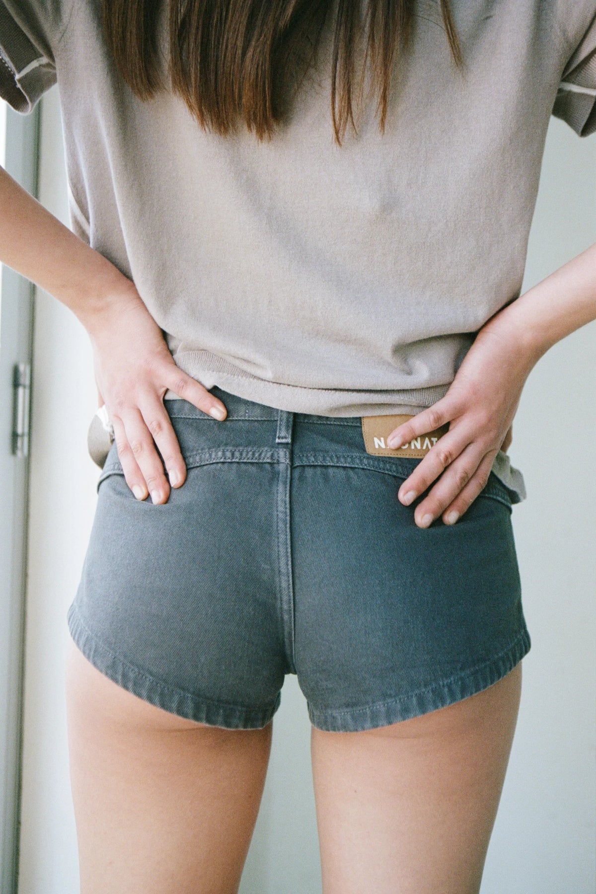 Nagnata Low Rise Micro Denim Short in Washed Black