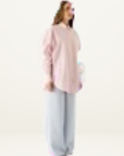 Esmaee Bayview button-down shirt in pink and white vertical stripes paired with light blue wide-leg trousers.