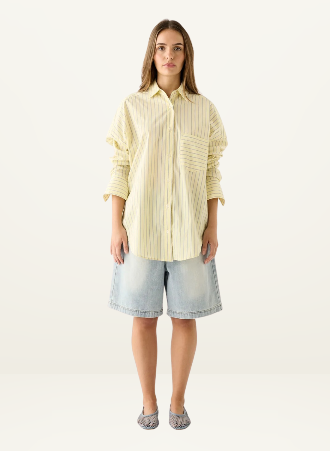 Esmaee Bayview button-down shirt in lemon yellow with vertical stripes, featuring a chest pocket and relaxed fit.