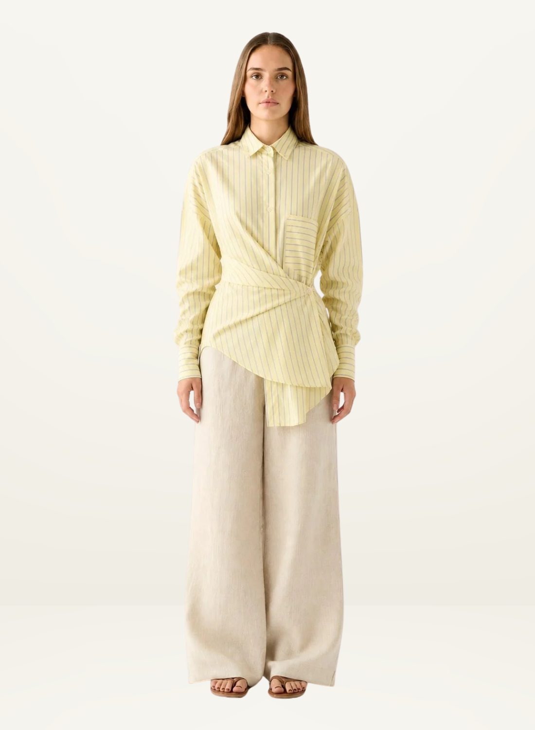 Esmaee Bayview button-down shirt in lemon yellow stripe with a wrap-front tie waist and long sleeves.