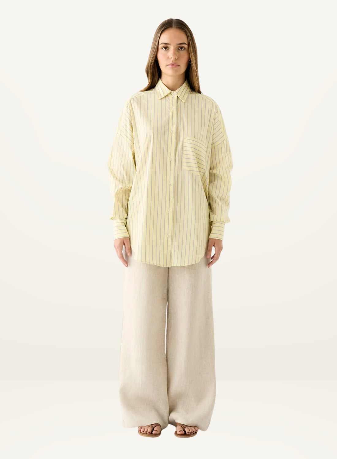 Esmaee Bayview oversized button-down shirt in lemon yellow with vertical stripes and a front chest pocket.