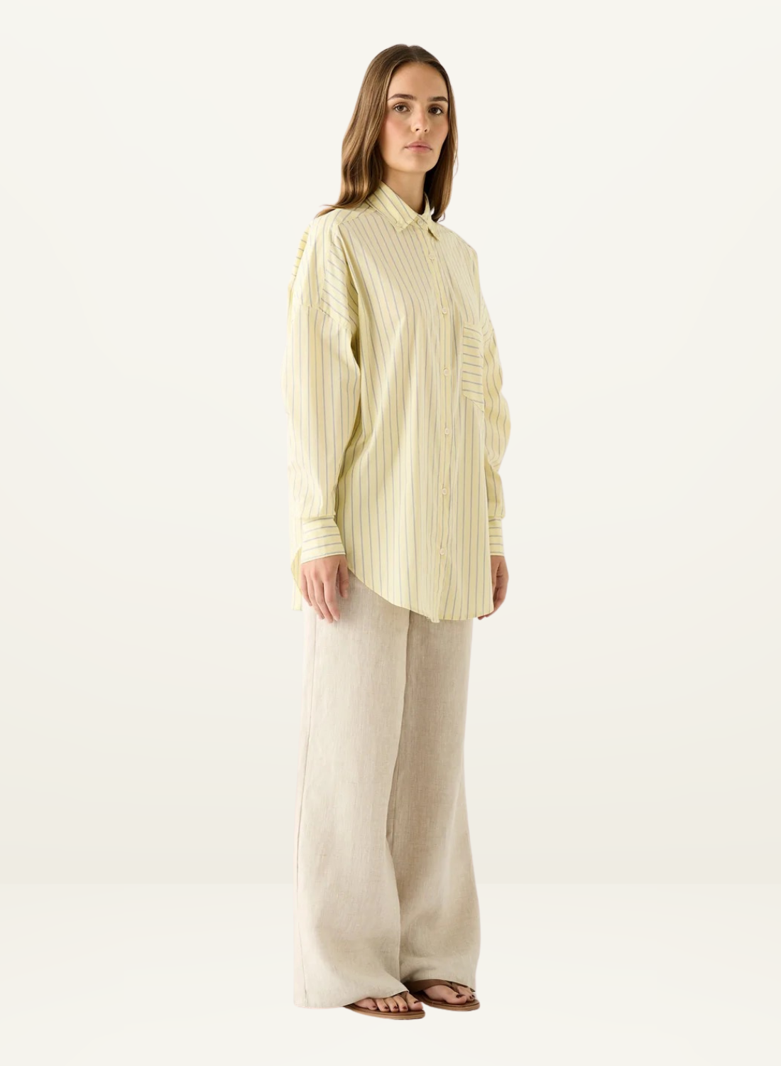 Esmaee Bayview button-down shirt in lemon yellow with vertical blue stripes, featuring a relaxed fit and chest pocket.