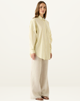 Esmaee Bayview button-down shirt in lemon yellow with vertical blue stripes, featuring a relaxed fit and chest pocket.