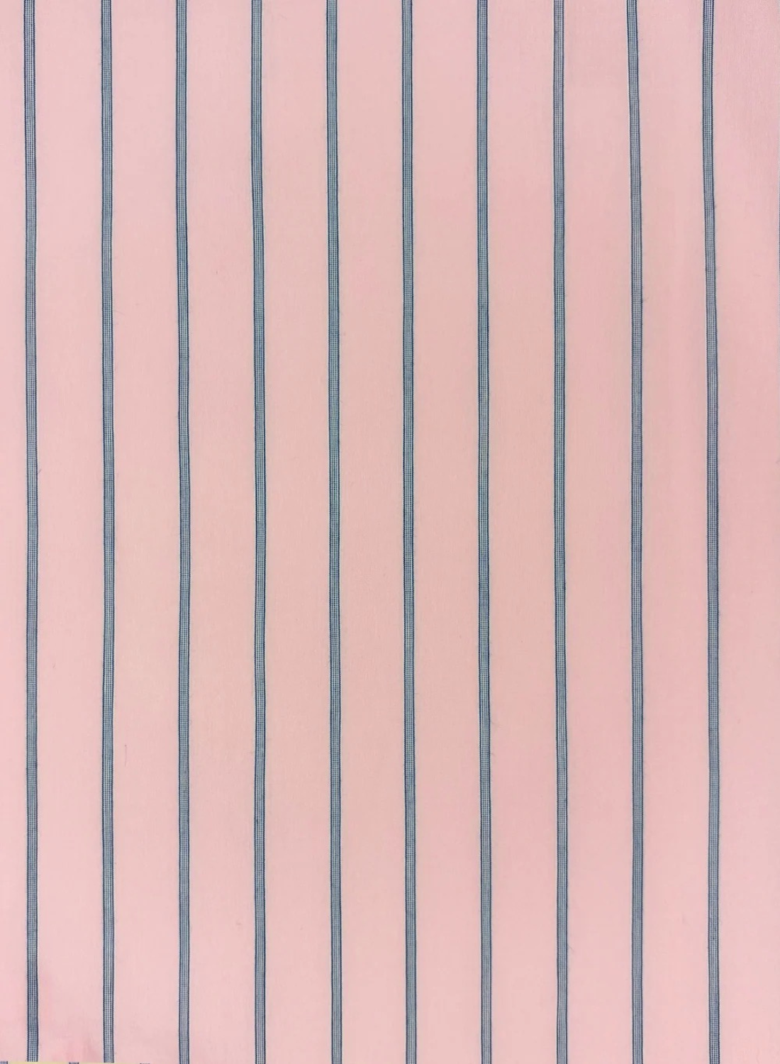 Esmaee Bayview shirt fabric featuring a soft pink base with vertical navy blue pinstripes in a textured cotton weave.
