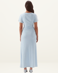 Back view of a sky blue Sovere Vera midi dress featuring short magyar sleeves, gathered waist detail, and stretchy mesh fabric.